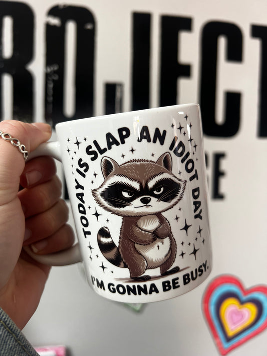 'Slap an idiot day' Funny racoon Mug